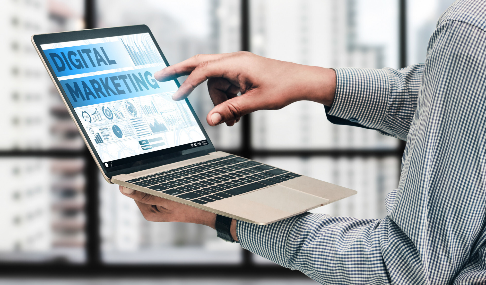 Accountant using digital marketing tools on a laptop.